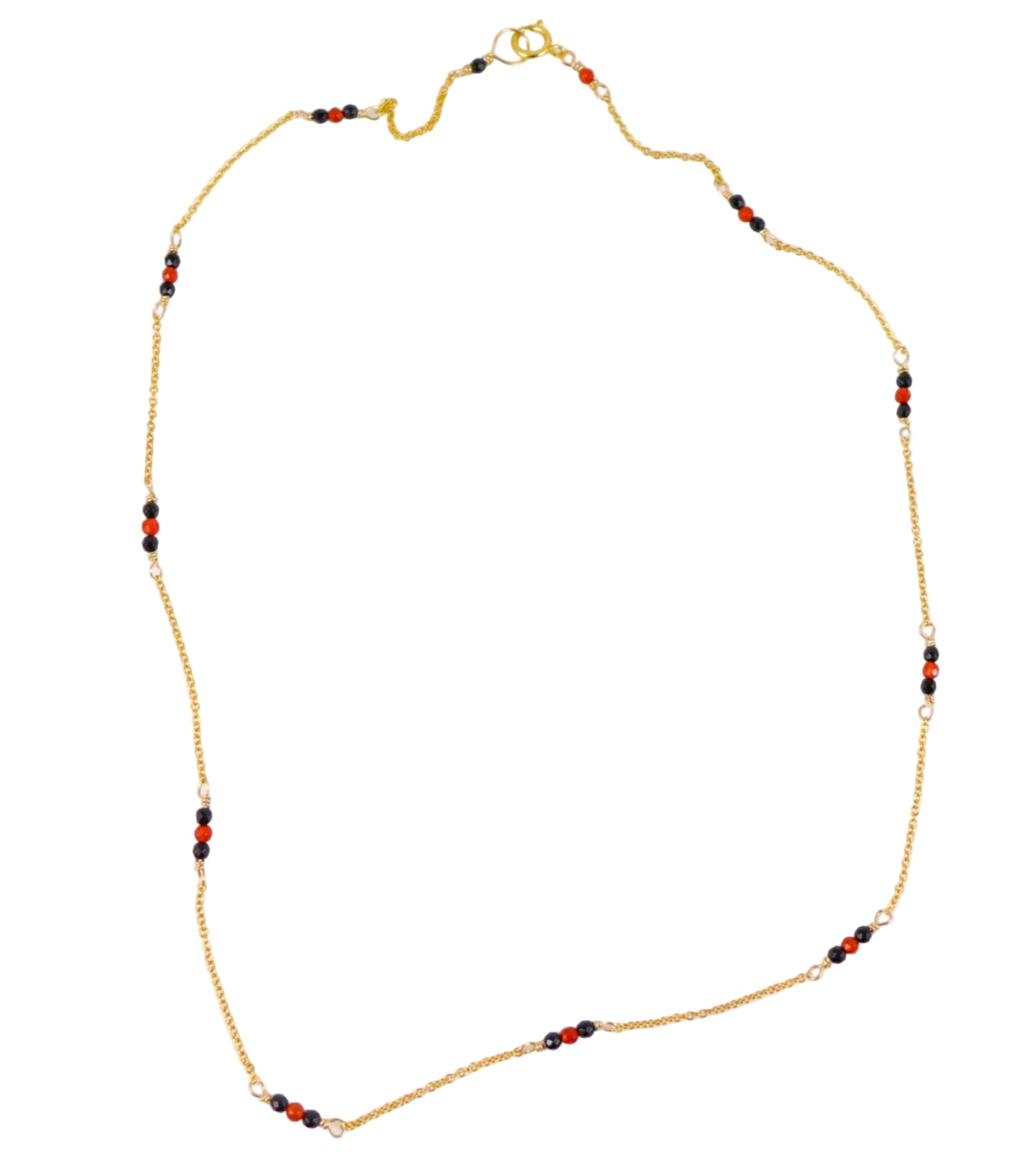 A gold chain necklace with small red and black beads spaced along the chain, displayed on a plain white background.